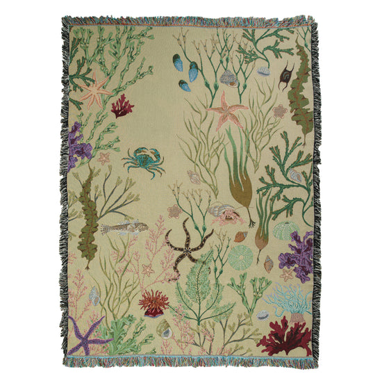 an "Intertidal Sand blanket" by Arcana with crabs, starfish and seaweed on it.