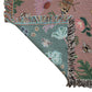 dusky pink woven wrap with bees, butterflies and flowers design showing front and back and woven fringe detail