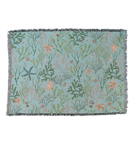 An Intertidal Star blanket with seaweed and corals on it, made by Arcana.