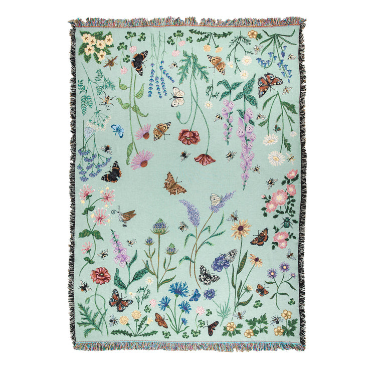 Pollination Meadow woven blanket from Arcana with butterflies, bees and wildflowers
