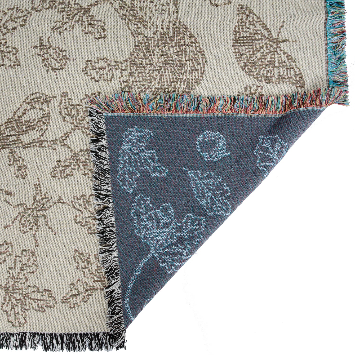 cream and blue two tone woven blanket featuring oak woodland butterfies and birds with fringe