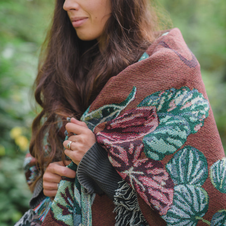woven throw blanket wrapped around shoulders 