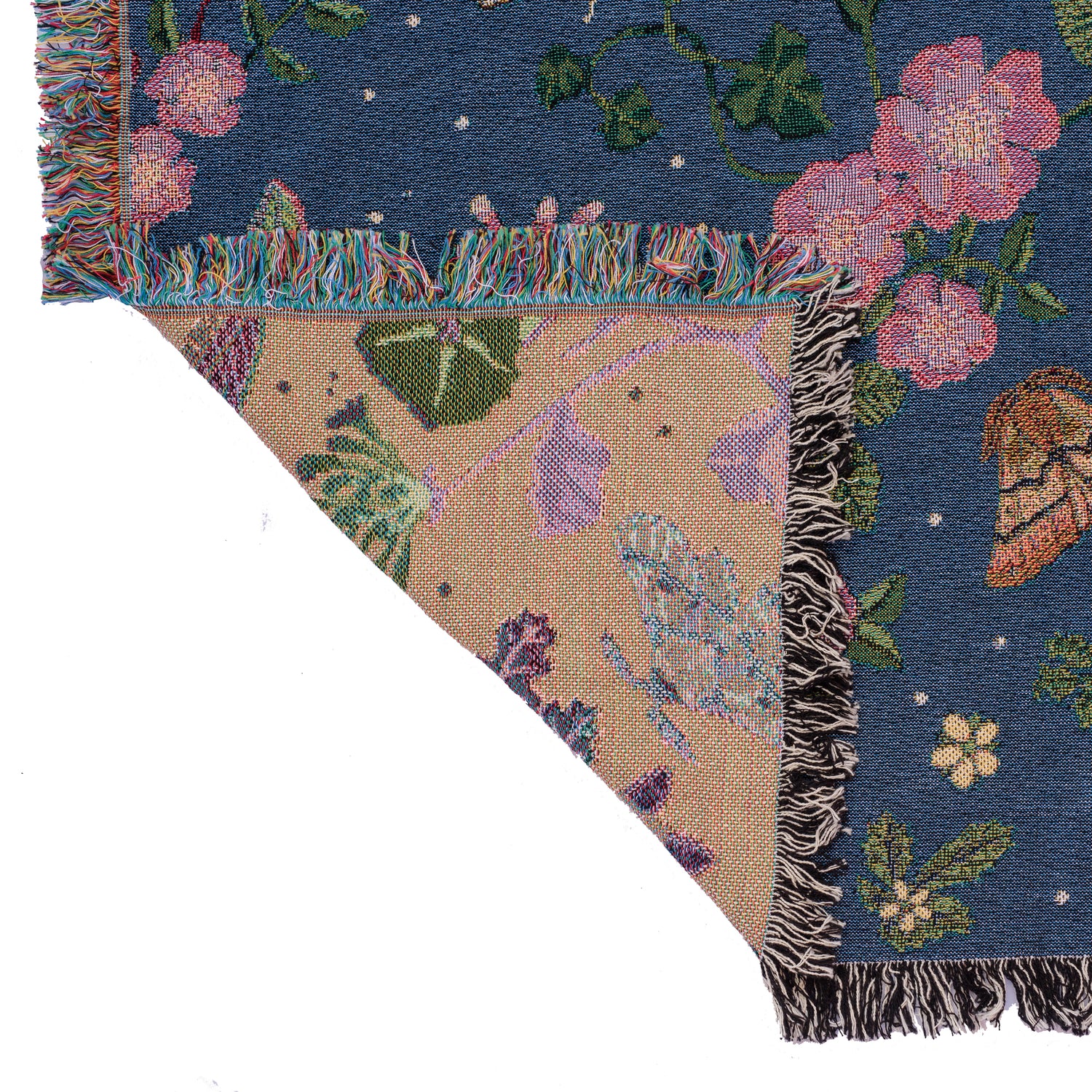 detail of small dark blue woven wrap blanket with delicate moth and flower pattern 