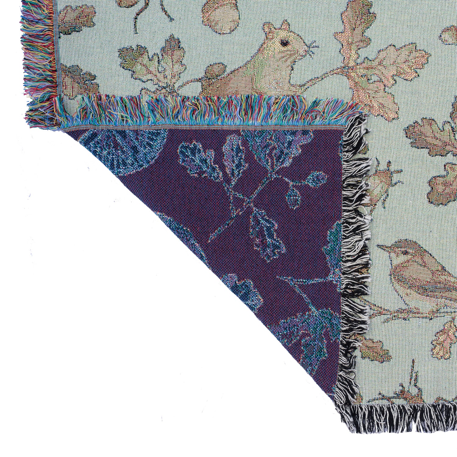 a blue and purple Wild Oak Wrap Blanket with birds and acorns on it, made by Arcana.